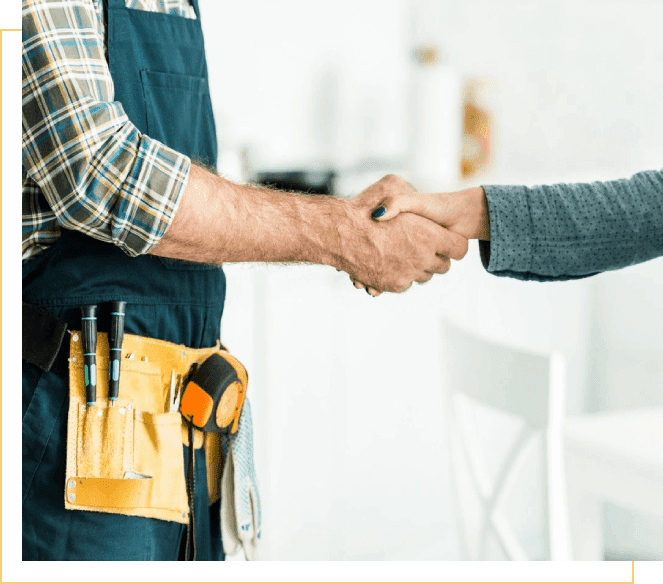 A man shaking hands with another person.